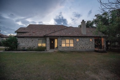 Tucked at the end of a quiet cul-de-sac, this thoughtfully on Apple Rock Golf Course - Horseshoe Bay in Texas - for sale on GolfHomes.com, golf home, golf lot