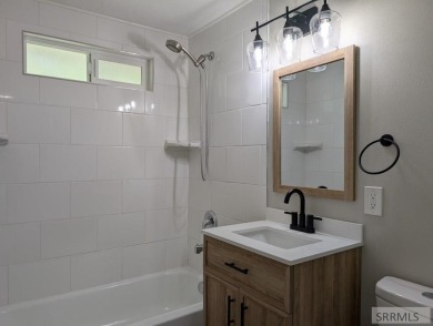 Step into this beautifully updated 3-bedroom, 2-bathroom home on Pinecrest Golf Club in Idaho - for sale on GolfHomes.com, golf home, golf lot