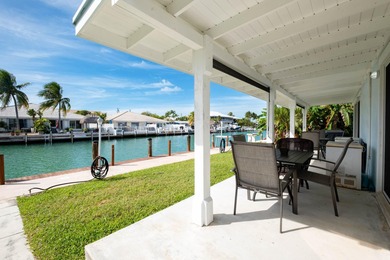 If you need more dockage than most half duplexes in Key Colony on Key Colony Beach Golf Course in Florida - for sale on GolfHomes.com, golf home, golf lot