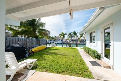 If you need more dockage than most half duplexes in Key Colony on Key Colony Beach Golf Course in Florida - for sale on GolfHomes.com, golf home, golf lot