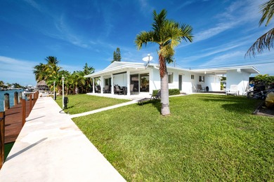 If you need more dockage than most half duplexes in Key Colony on Key Colony Beach Golf Course in Florida - for sale on GolfHomes.com, golf home, golf lot