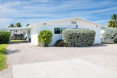 If you need more dockage than most half duplexes in Key Colony on Key Colony Beach Golf Course in Florida - for sale on GolfHomes.com, golf home, golf lot