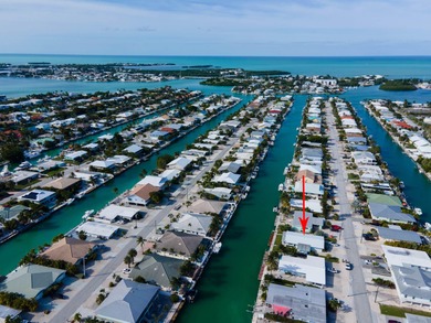 If you need more dockage than most half duplexes in Key Colony on Key Colony Beach Golf Course in Florida - for sale on GolfHomes.com, golf home, golf lot