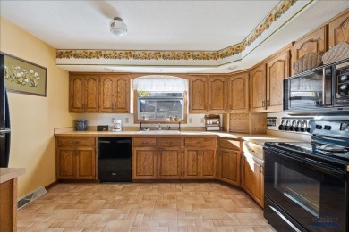Charming home in the heart of Spearfish! Located just blocks on Spearfish Canyon Country Club in South Dakota - for sale on GolfHomes.com, golf home, golf lot