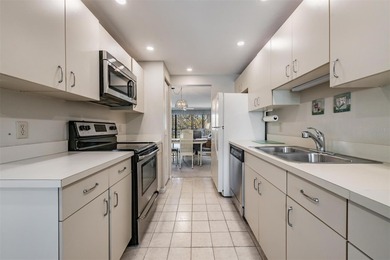 Tucked inside the ever-popular 3400 building of Village 4 in on Cove Cay Country Club in Florida - for sale on GolfHomes.com, golf home, golf lot