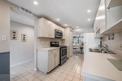 Tucked inside the ever-popular 3400 building of Village 4 in on Cove Cay Country Club in Florida - for sale on GolfHomes.com, golf home, golf lot