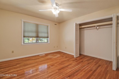 Lake-view living on a wooded acre-this 1,800 SF, single-level on Lake Tansi Village Country Club in Tennessee - for sale on GolfHomes.com, golf home, golf lot