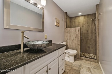 Lake-view living on a wooded acre-this 1,800 SF, single-level on Lake Tansi Village Country Club in Tennessee - for sale on GolfHomes.com, golf home, golf lot