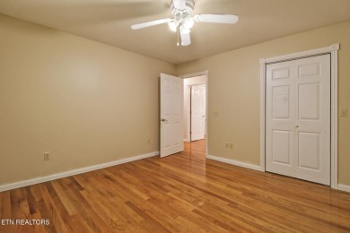 Lake-view living on a wooded acre-this 1,800 SF, single-level on Lake Tansi Village Country Club in Tennessee - for sale on GolfHomes.com, golf home, golf lot