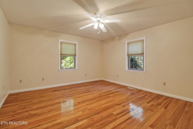 Lake-view living on a wooded acre-this 1,800 SF, single-level on Lake Tansi Village Country Club in Tennessee - for sale on GolfHomes.com, golf home, golf lot