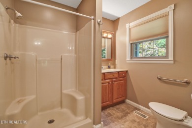 Lake-view living on a wooded acre-this 1,800 SF, single-level on Lake Tansi Village Country Club in Tennessee - for sale on GolfHomes.com, golf home, golf lot