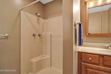 Lake-view living on a wooded acre-this 1,800 SF, single-level on Lake Tansi Village Country Club in Tennessee - for sale on GolfHomes.com, golf home, golf lot