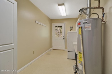 Lake-view living on a wooded acre-this 1,800 SF, single-level on Lake Tansi Village Country Club in Tennessee - for sale on GolfHomes.com, golf home, golf lot