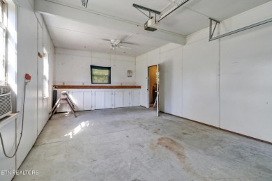 Lake-view living on a wooded acre-this 1,800 SF, single-level on Lake Tansi Village Country Club in Tennessee - for sale on GolfHomes.com, golf home, golf lot