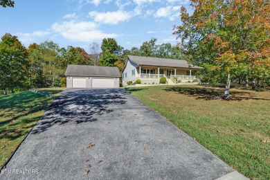 Lake-view living on a wooded acre-this 1,800 SF, single-level on Lake Tansi Village Country Club in Tennessee - for sale on GolfHomes.com, golf home, golf lot