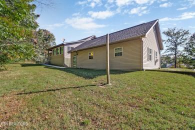 Lake-view living on a wooded acre-this 1,800 SF, single-level on Lake Tansi Village Country Club in Tennessee - for sale on GolfHomes.com, golf home, golf lot