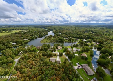 Lake-view living on a wooded acre-this 1,800 SF, single-level on Lake Tansi Village Country Club in Tennessee - for sale on GolfHomes.com, golf home, golf lot
