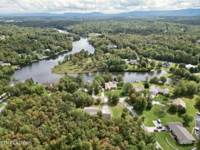 Lake-view living on a wooded acre-this 1,800 SF, single-level on Lake Tansi Village Country Club in Tennessee - for sale on GolfHomes.com, golf home, golf lot
