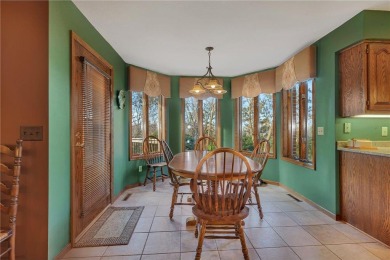 This walkout two-story home sits on a 1/2 acre treed lot and has on St. Cloud Country Club in Minnesota - for sale on GolfHomes.com, golf home, golf lot