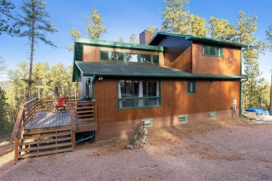 TURNKEY CABIN RETREAT. This three-level cabin sits in the pines on  in South Dakota - for sale on GolfHomes.com, golf home, golf lot