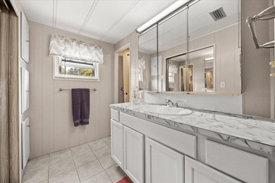 Grab your Towel and Sunscreen and WALK to the Heated Salt Water on Zellwood Station Country Club in Florida - for sale on GolfHomes.com, golf home, golf lot