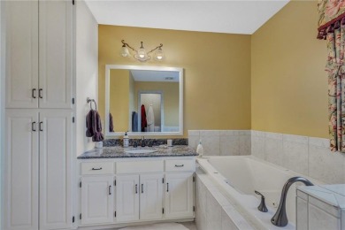 This walkout two-story home sits on a 1/2 acre treed lot and has on St. Cloud Country Club in Minnesota - for sale on GolfHomes.com, golf home, golf lot