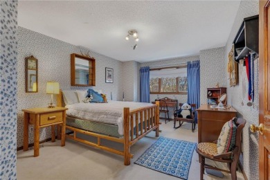 This walkout two-story home sits on a 1/2 acre treed lot and has on St. Cloud Country Club in Minnesota - for sale on GolfHomes.com, golf home, golf lot
