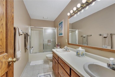 This walkout two-story home sits on a 1/2 acre treed lot and has on St. Cloud Country Club in Minnesota - for sale on GolfHomes.com, golf home, golf lot