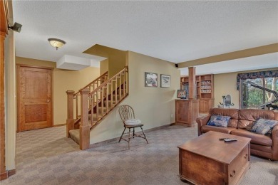 This walkout two-story home sits on a 1/2 acre treed lot and has on St. Cloud Country Club in Minnesota - for sale on GolfHomes.com, golf home, golf lot