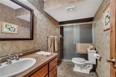 This walkout two-story home sits on a 1/2 acre treed lot and has on St. Cloud Country Club in Minnesota - for sale on GolfHomes.com, golf home, golf lot