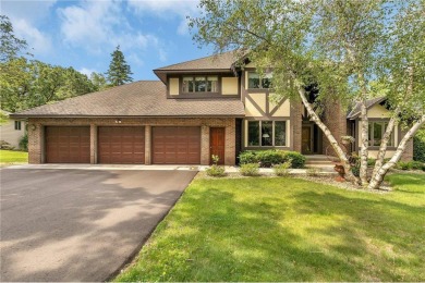 This walkout two-story home sits on a 1/2 acre treed lot and has on St. Cloud Country Club in Minnesota - for sale on GolfHomes.com, golf home, golf lot