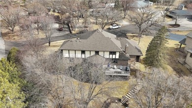 This walkout two-story home sits on a 1/2 acre treed lot and has on St. Cloud Country Club in Minnesota - for sale on GolfHomes.com, golf home, golf lot