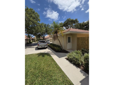 Fabulous and most desired 1 level end unit patio home with 2 BR on PGA National Golf Club in Florida - for sale on GolfHomes.com, golf home, golf lot