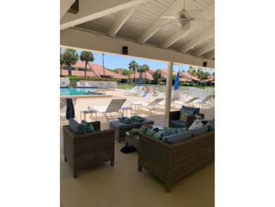 Fabulous and most desired 1 level end unit patio home with 2 BR on PGA National Golf Club in Florida - for sale on GolfHomes.com, golf home, golf lot