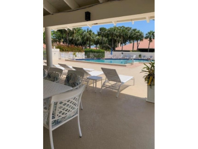 Fabulous and most desired 1 level end unit patio home with 2 BR on PGA National Golf Club in Florida - for sale on GolfHomes.com, golf home, golf lot