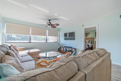 This 4th-floor 55+ penthouse condo offers spectacular views of on Sunrise Lakes Phase III in Florida - for sale on GolfHomes.com, golf home, golf lot