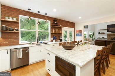 This custom-built home sits on a roundabout cul-de-sac nestled on Hampton Golf Village in Georgia - for sale on GolfHomes.com, golf home, golf lot