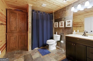 This custom-built home sits on a roundabout cul-de-sac nestled on Hampton Golf Village in Georgia - for sale on GolfHomes.com, golf home, golf lot