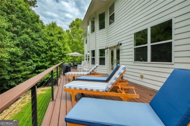 This custom-built home sits on a roundabout cul-de-sac nestled on Hampton Golf Village in Georgia - for sale on GolfHomes.com, golf home, golf lot