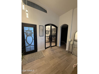 This beautiful home blends modern upgrades with resort-style on Tuscany Falls At Pebble Creek in Arizona - for sale on GolfHomes.com, golf home, golf lot