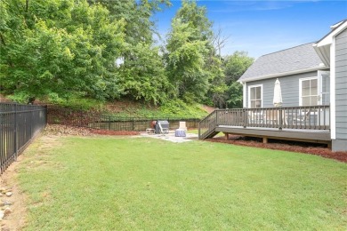 It looks like something out of a storybook--crisp trim on Reunion Golf Club in Georgia - for sale on GolfHomes.com, golf home, golf lot