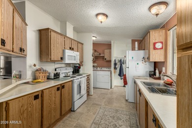 This beautifully maintained, fully furnished home features a on 3 Parks Fairways in Arizona - for sale on GolfHomes.com, golf home, golf lot