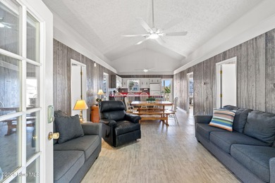 Charming Beach Cottage on Canal Lot with Boat Dock This is a on Sea Trail Golf Resort in North Carolina - for sale on GolfHomes.com, golf home, golf lot