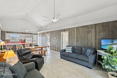 Charming Beach Cottage on Canal Lot with Boat Dock This is a on Sea Trail Golf Resort in North Carolina - for sale on GolfHomes.com, golf home, golf lot