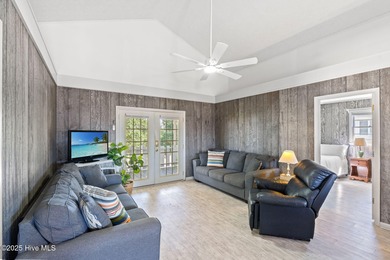 Charming Beach Cottage on Canal Lot with Boat Dock This is a on Sea Trail Golf Resort in North Carolina - for sale on GolfHomes.com, golf home, golf lot