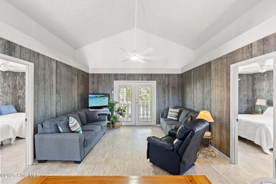 Charming Beach Cottage on Canal Lot with Boat Dock This is a on Sea Trail Golf Resort in North Carolina - for sale on GolfHomes.com, golf home, golf lot