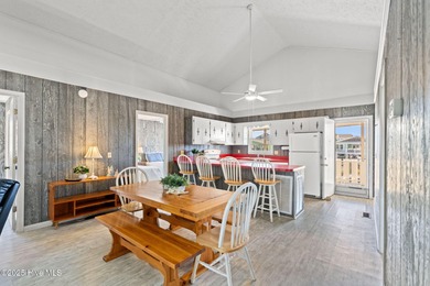 Charming Beach Cottage on Canal Lot with Boat Dock This is a on Sea Trail Golf Resort in North Carolina - for sale on GolfHomes.com, golf home, golf lot