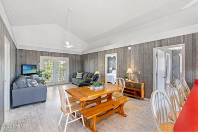 Charming Beach Cottage on Canal Lot with Boat Dock This is a on Sea Trail Golf Resort in North Carolina - for sale on GolfHomes.com, golf home, golf lot