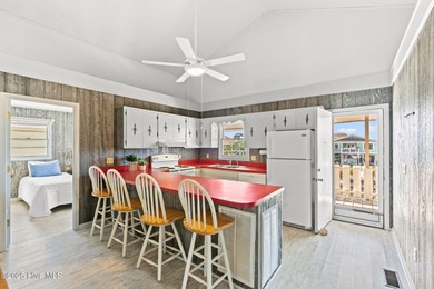 Charming Beach Cottage on Canal Lot with Boat Dock This is a on Sea Trail Golf Resort in North Carolina - for sale on GolfHomes.com, golf home, golf lot