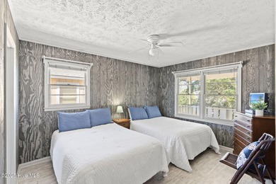 Charming Beach Cottage on Canal Lot with Boat Dock This is a on Sea Trail Golf Resort in North Carolina - for sale on GolfHomes.com, golf home, golf lot